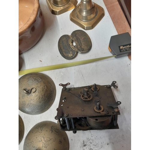 248 - Box of oddments : brass candlesticks, kettle stand, Indian inlaid box, Chinese brass bells etc.