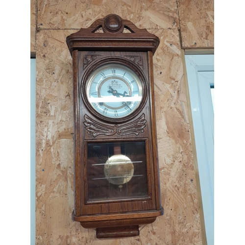 263 - Watts and Sons oak case striking wall clock