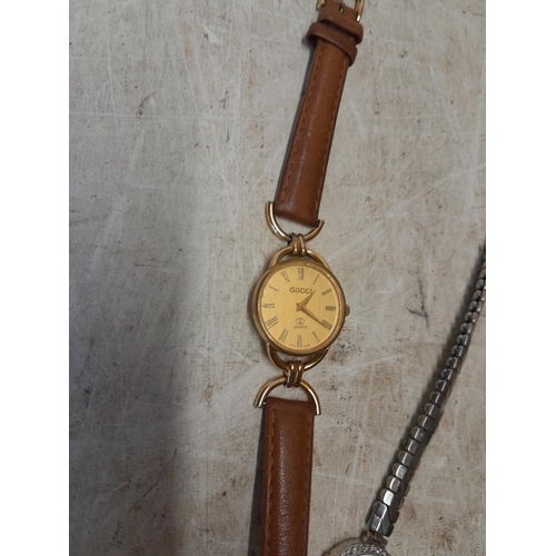 272 - Ladies Gucci wristwatch with scuffed face, leather strap and Avia watch