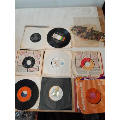 316 - Assorted interesting vinyl record singles, many centres missing, from a private juke box