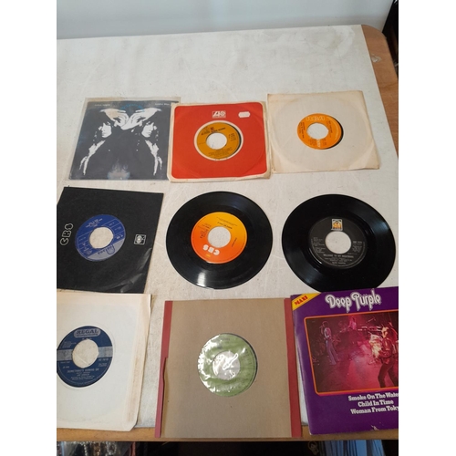 316 - Assorted interesting vinyl record singles, many centres missing, from a private juke box