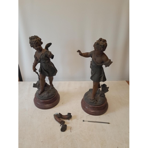 328 - Pair of late 19th century damaged spelter figures of cherubs