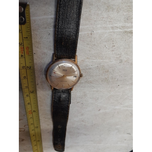 394 - Vintage Smiths gents wristwatch with steel back, leather strap and unmarked  9 ct gold housing