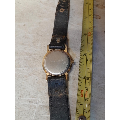 394 - Vintage Smiths gents wristwatch with steel back, leather strap and unmarked  9 ct gold housing