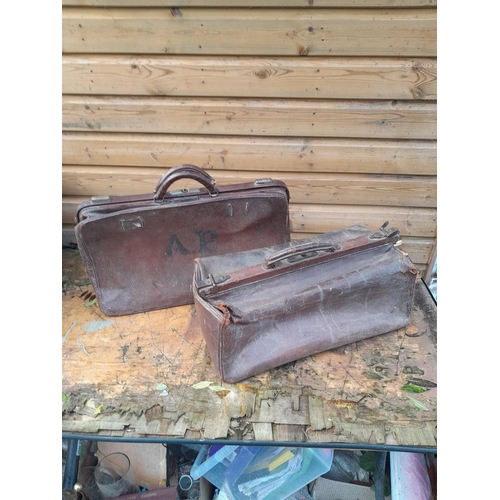 426 - 2 x vintage leather luggage with advertising labels