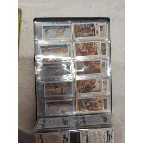 25 - Assorted cigarette cards mounted in a modern album