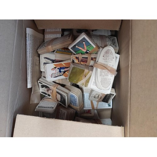 34 - Fruit box full of tea, cigarette and trade cards, loose packeted by type, incomplete sets from major... 