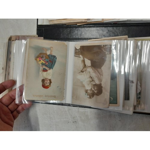 38 - modern photograph album full of early 20th century coloured and black and white postcards, mainly se... 