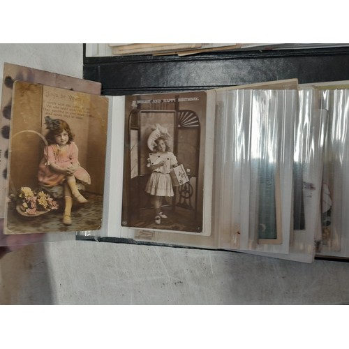 38 - modern photograph album full of early 20th century coloured and black and white postcards, mainly se... 