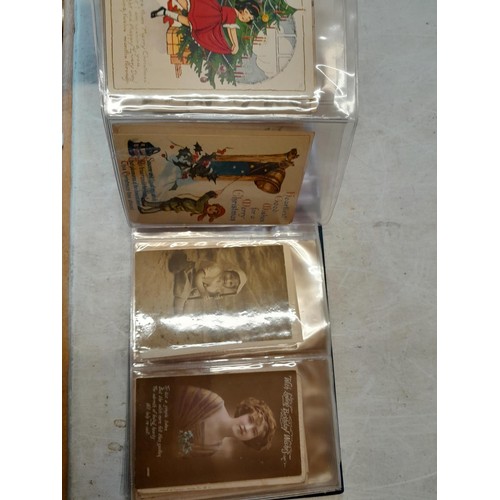 47 - Early - mid 20th century postcards mainly sentimental and greeting cards in two well filled albums