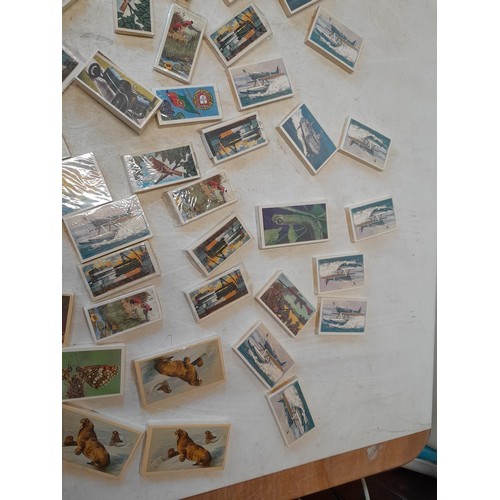 48 - Assorted differing sized format trade, cigarette and tea cards mainly in sealed packets