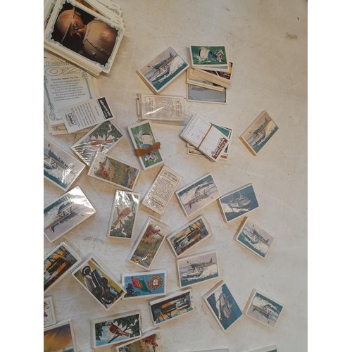 48 - Assorted differing sized format trade, cigarette and tea cards mainly in sealed packets