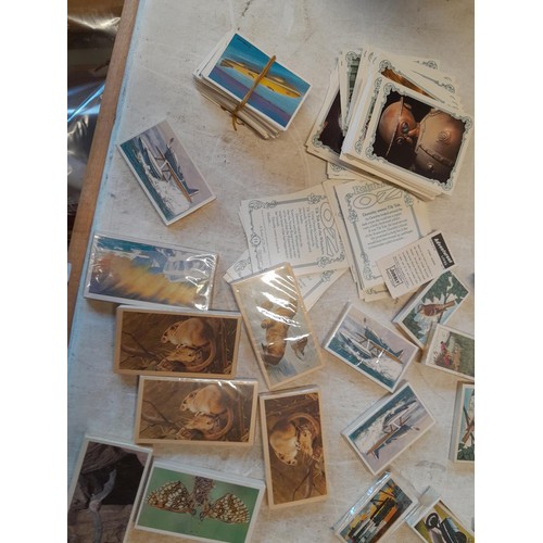 48 - Assorted differing sized format trade, cigarette and tea cards mainly in sealed packets