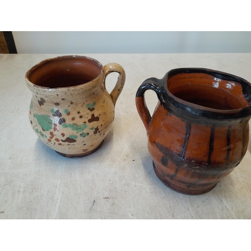 82 - 4 x pre 1900 slip glaze decorated earthenware mugs