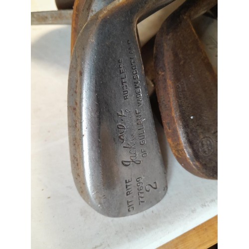 128 - A mixed era , pre 1950 array of hickory shafted gold clubs in canvas bag