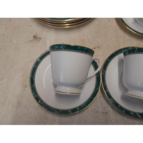 138 - Royal Worcester Medici pattern green and gilt 8 place setting dinner service in good order