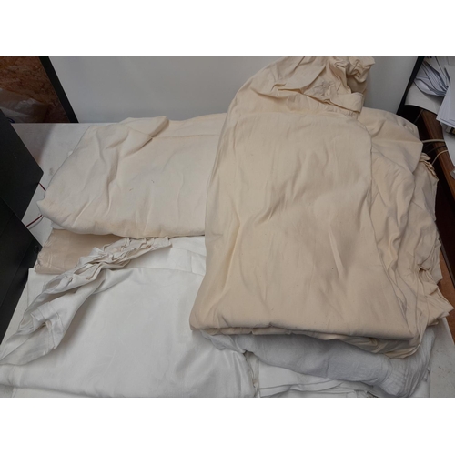 84 - Box full of vintage French linen bedsheets, cotton damask bedspreads, table linen etc.