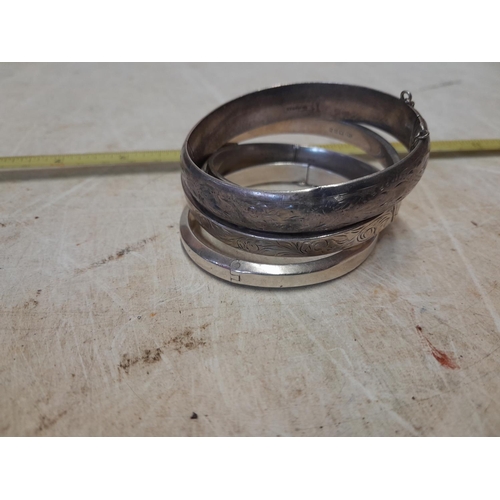 168 - 4 x vintage silver hinged bangles, some engraved