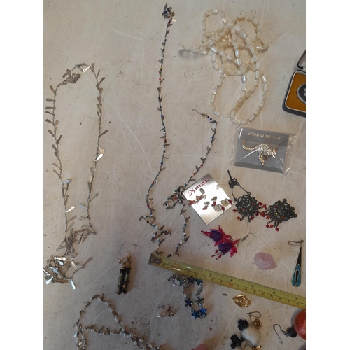 60 - Assorted costume jewellery, silver included, earrings and necklaces etc.