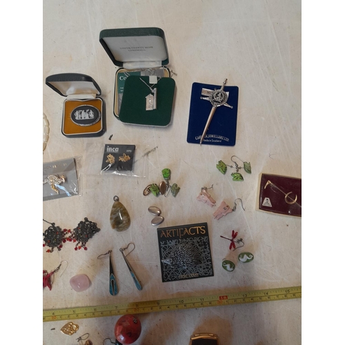 60 - Assorted costume jewellery, silver included, earrings and necklaces etc.