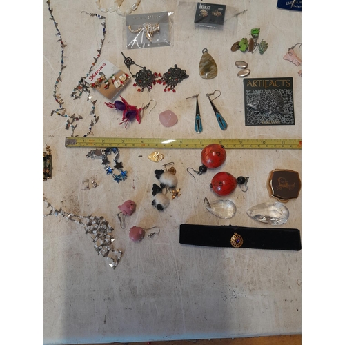 60 - Assorted costume jewellery, silver included, earrings and necklaces etc.