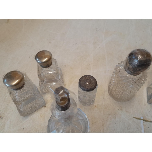 90 - Various silver lidded scent bottles, dressing table jars etc. some with damaged lids