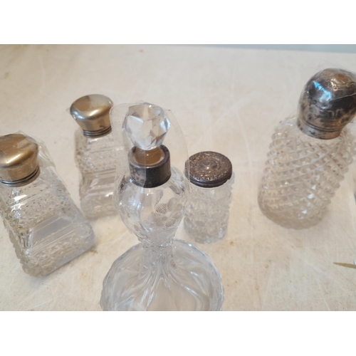 90 - Various silver lidded scent bottles, dressing table jars etc. some with damaged lids