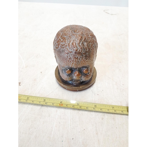 208 - Copper alloy bust of a baby head on stand