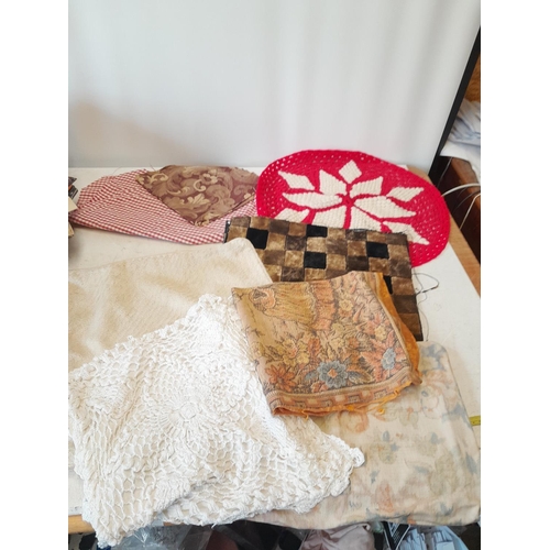 327 - Fabric remnants, cushion covers and woollen table mat