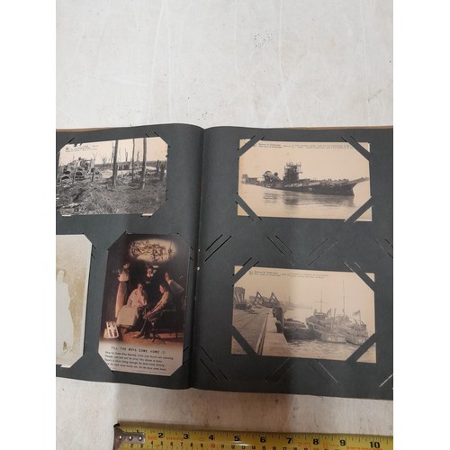 574 - An album of black and white military interest postcards, World War I and War II interest