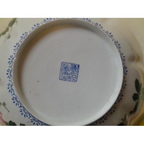 46 - Lightly potted Chinese porcelain lobed bowl decorated with flowers, signed underneath