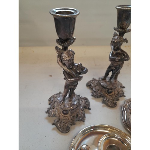 203 - Pair of silver plated cherub candlesticks, 2 x chamber sticks etc.