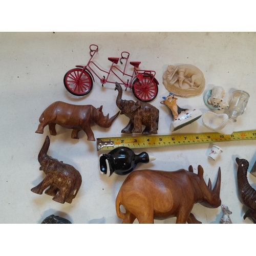 35 - Assorted ornaments : wooden elephants, pottery cats and dogs, resin figure etc.