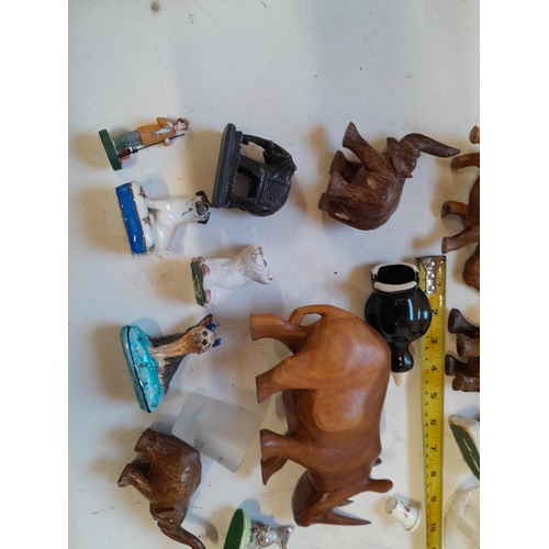 35 - Assorted ornaments : wooden elephants, pottery cats and dogs, resin figure etc.