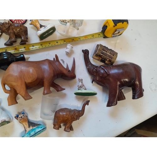 35 - Assorted ornaments : wooden elephants, pottery cats and dogs, resin figure etc.