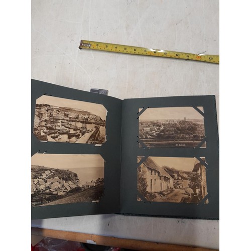 170 - Album full of early 20th century coloured and black and white postcards all relating to Cornwall