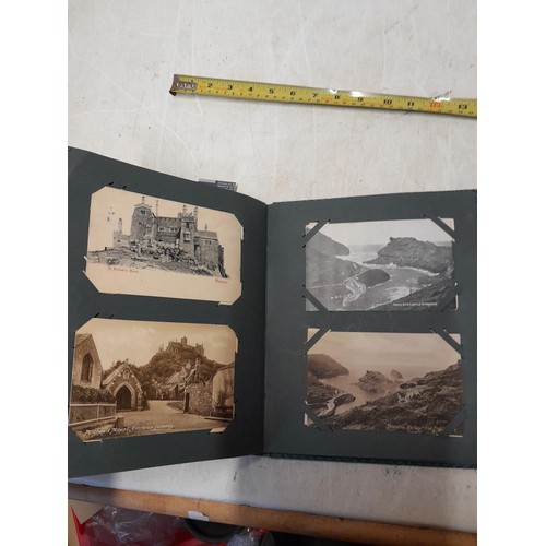 170 - Album full of early 20th century coloured and black and white postcards all relating to Cornwall