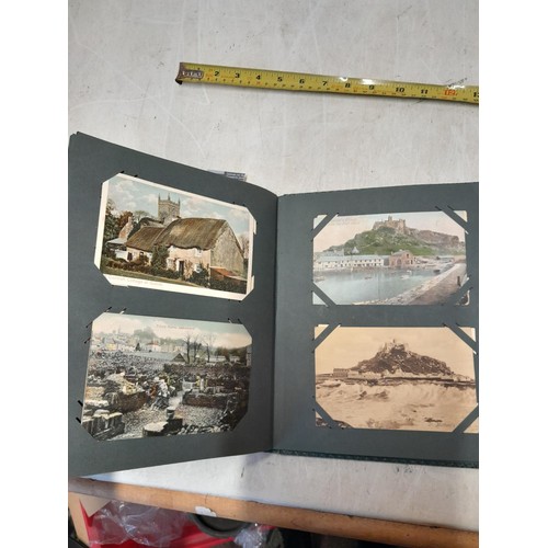 170 - Album full of early 20th century coloured and black and white postcards all relating to Cornwall