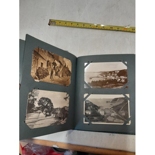 170 - Album full of early 20th century coloured and black and white postcards all relating to Cornwall