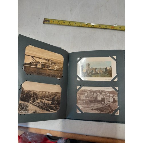 170 - Album full of early 20th century coloured and black and white postcards all relating to Cornwall