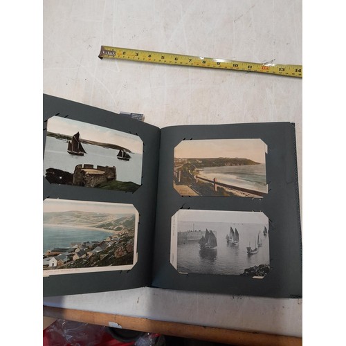 170 - Album full of early 20th century coloured and black and white postcards all relating to Cornwall