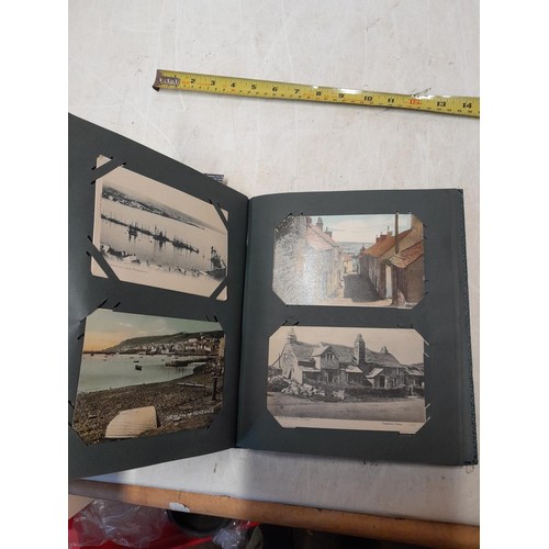 170 - Album full of early 20th century coloured and black and white postcards all relating to Cornwall