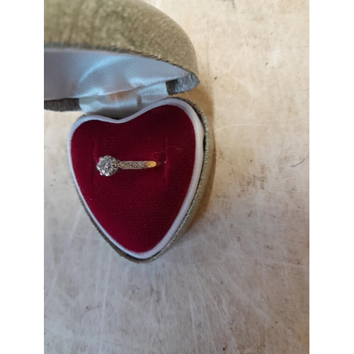 280 - 18 ct gold ring set with  single diamond and further diamonds down the shank in heart shape presenta... 