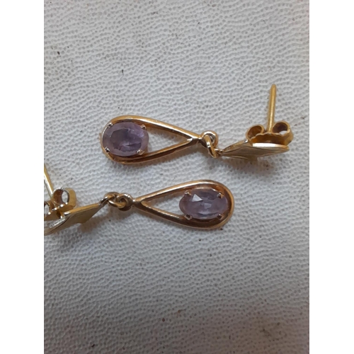 34 - Pair of pretty unmarked 9 ct gold earrings set with amethyst 3.3 g