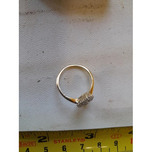 42 - Unmarked but tested 18 ct gold ring oval set with approx 20 diamonds of varying size , size N, 3.6 g