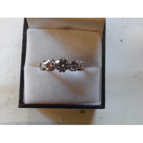 43 - Good quality unmarked but tested 18 ct gold and platinum ring set with five graduated diamonds size ... 