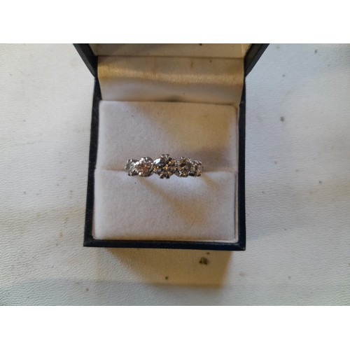 43 - Good quality unmarked but tested 18 ct gold and platinum ring set with five graduated diamonds size ... 