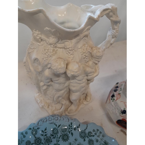 61 - Decorative china : restored Charles Meigh relief parian ware jug depicting Bacchanalian Scene, Gaudy... 