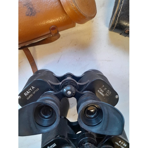 136 - 2 pairs of binoculars in leather cases : Raiya 7 x 50 & 1 x Titan 8 x 56