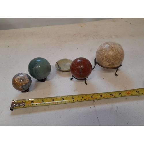 174 - Hardstone balls on stands